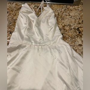 Ivory silk dress. Open back with cross cross straps. Beautiful and worn once